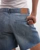 Weekday Weekday low waist baggy denim shorts with twisted front seam in blue wash - 4