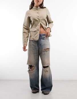 Weekday Weekday low waist baggy wide leg jeans with distressed details in blue with pink tint